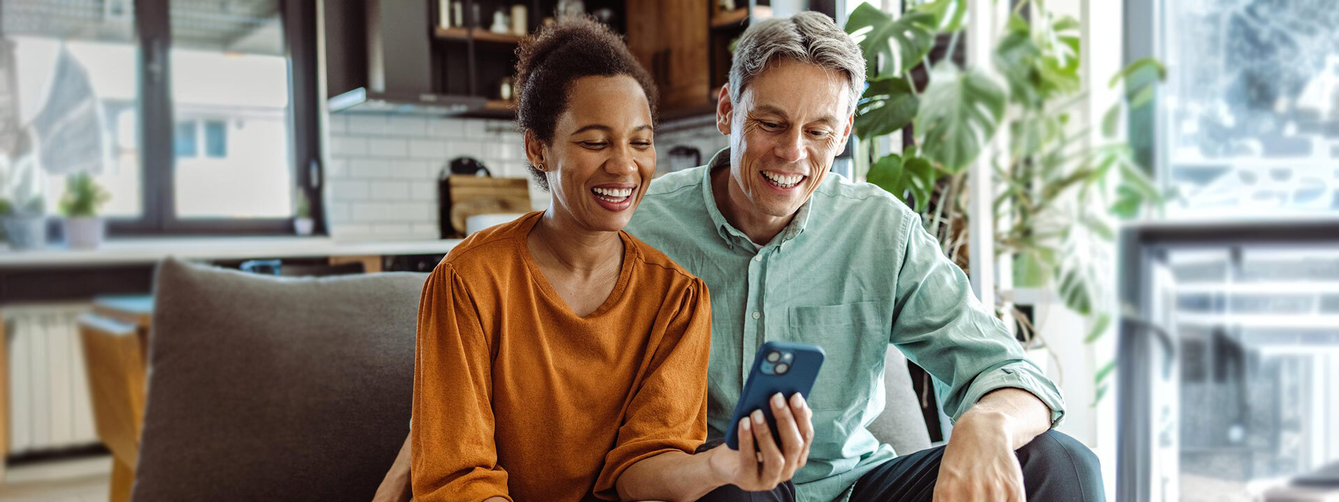 smiling couple on couch